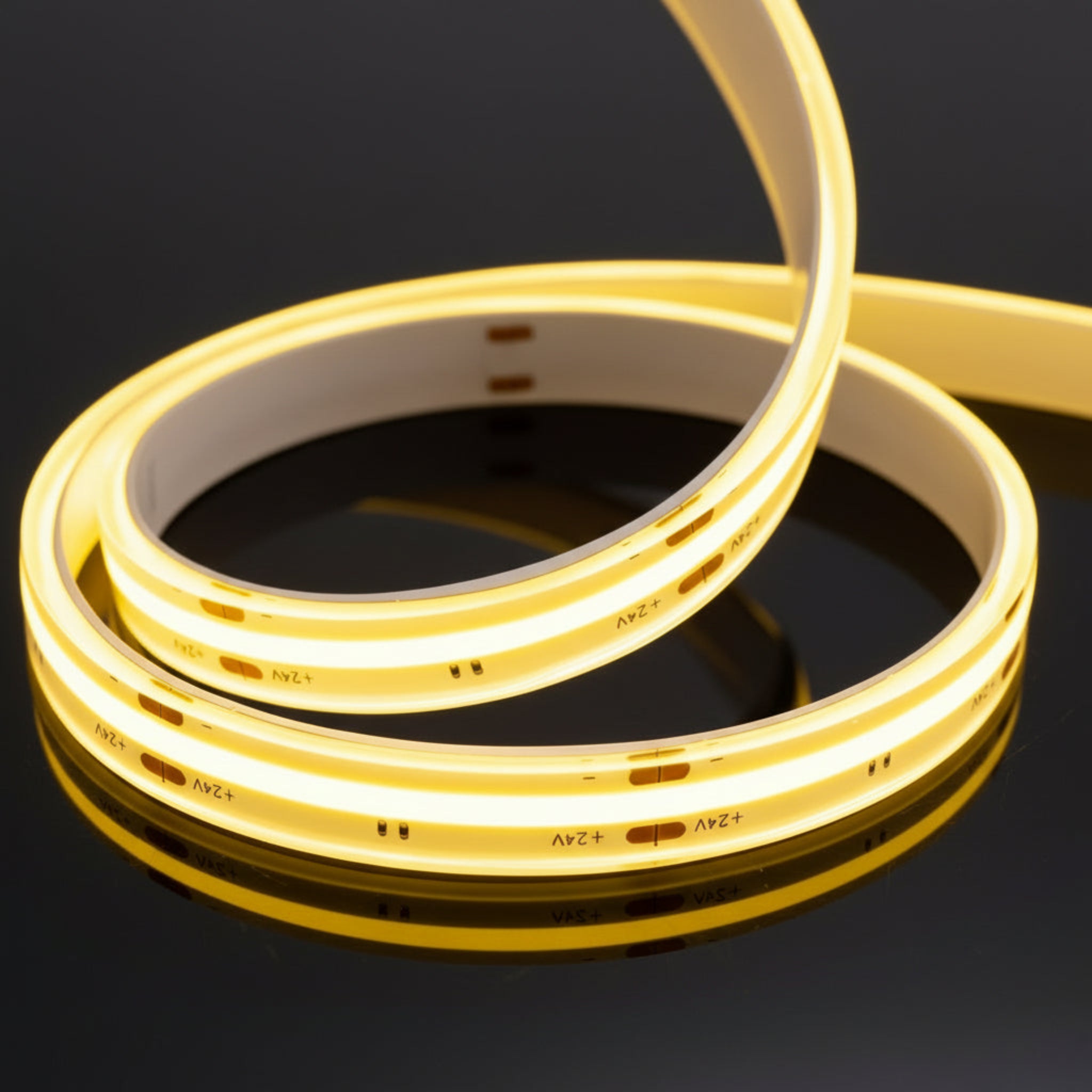 Coiled LED strip light on a white background