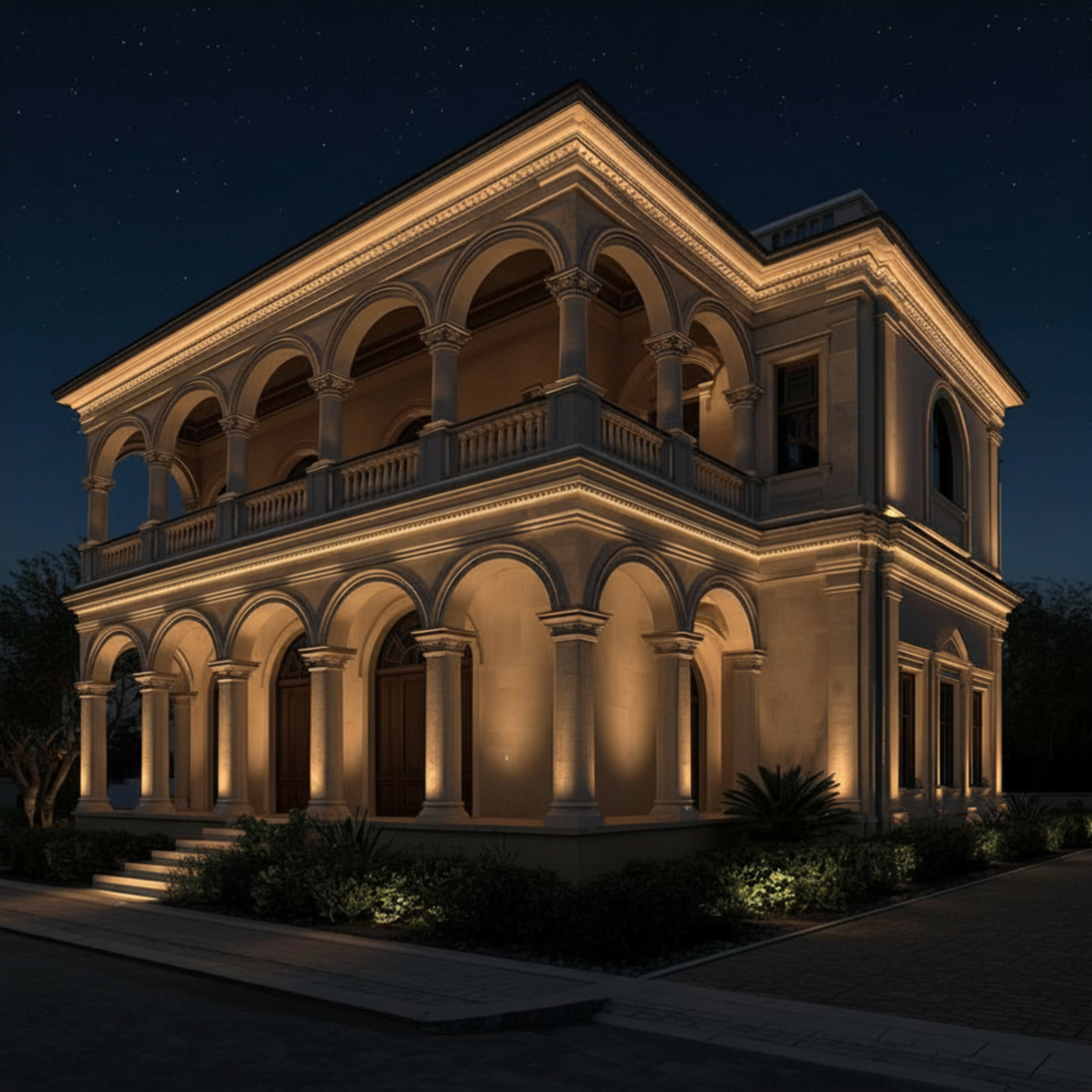Elegant two-story building with architectural details illuminated at night.