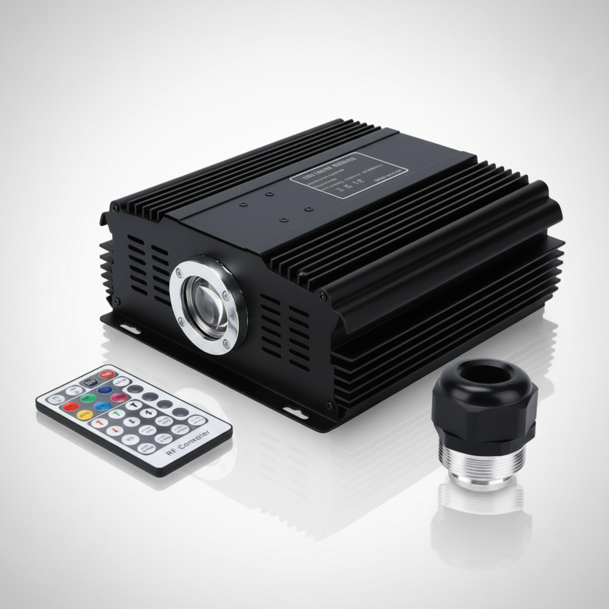 Black electronic device with remote control and adapter on a white background